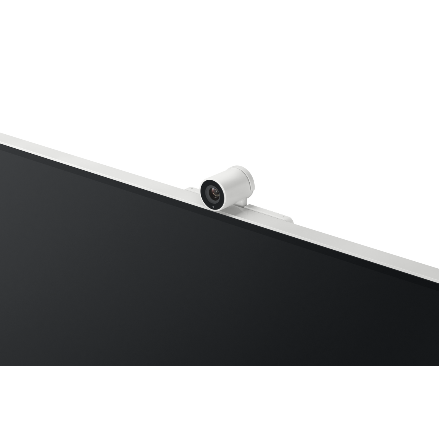 Une webcam blanche est posée sur un moniteur noir. La webcam est cylindrique et possède un objectif visible. Le fond est noir.