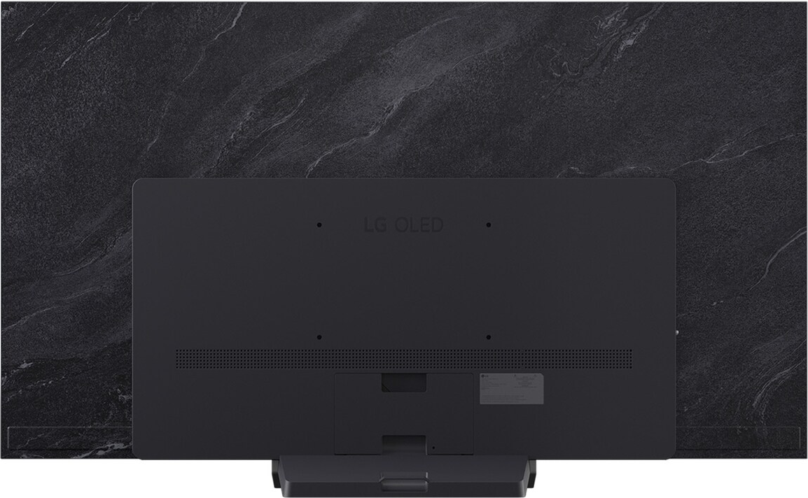 Vue arrière d'un téléviseur LG OLED gris foncé sur un fond texturé en forme de pierre. Le support est visible. Le logo est en haut.