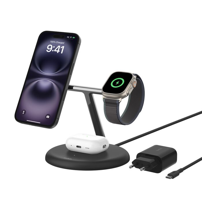 Estación de carga con teléfono, reloj y AirPods. El teléfono muestra las 9:41. El reloj y el teléfono se están cargando. Hay un cargador negro.