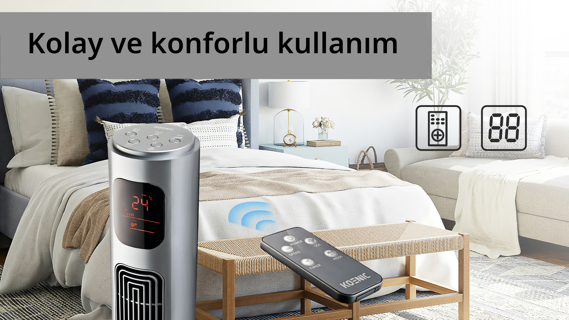 Yatak odasında ekranlı gümüş bir vantilatör. Bir bankta uzaktan kumanda. Arka planda bir yatak ve bir kanepe.