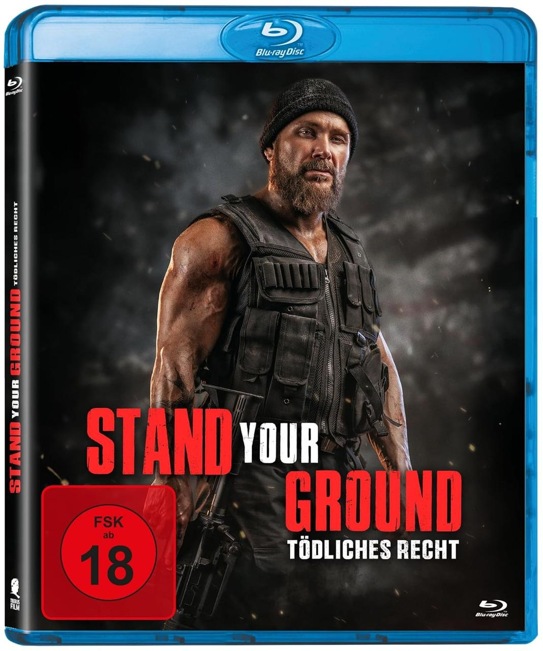 Blu-ray-Cover. Ein Mann in taktischer Weste, Mütze und Bart. Text: Stand Your Ground. FSK 18.