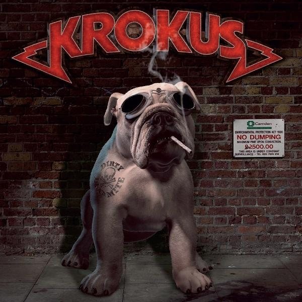 Eine Bulldogge mit Sonnenbrille und Zigarette sitzt vor einer Backsteinmauer. Der Bandname Krokus steht oben.