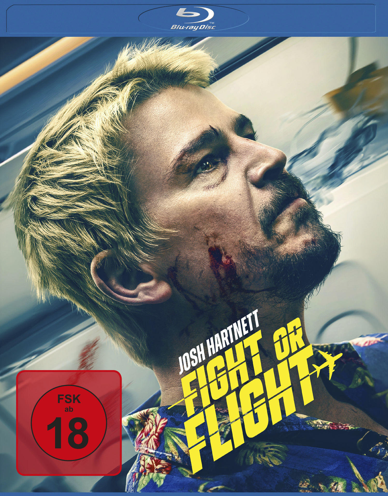 Blu-ray-Cover von 'Fight or Flight'. Josh Hartnett, verletzt, blickt nach oben. Gelber Titel, Flugzeuggrafik. Rote FSK 18-Bewertung.