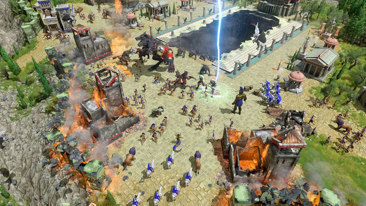 Una escena de batalla de un juego de estrategia. Los edificios están en llamas. Soldados y criaturas míticas se enfrentan. Un rayo golpea el campo de batalla.