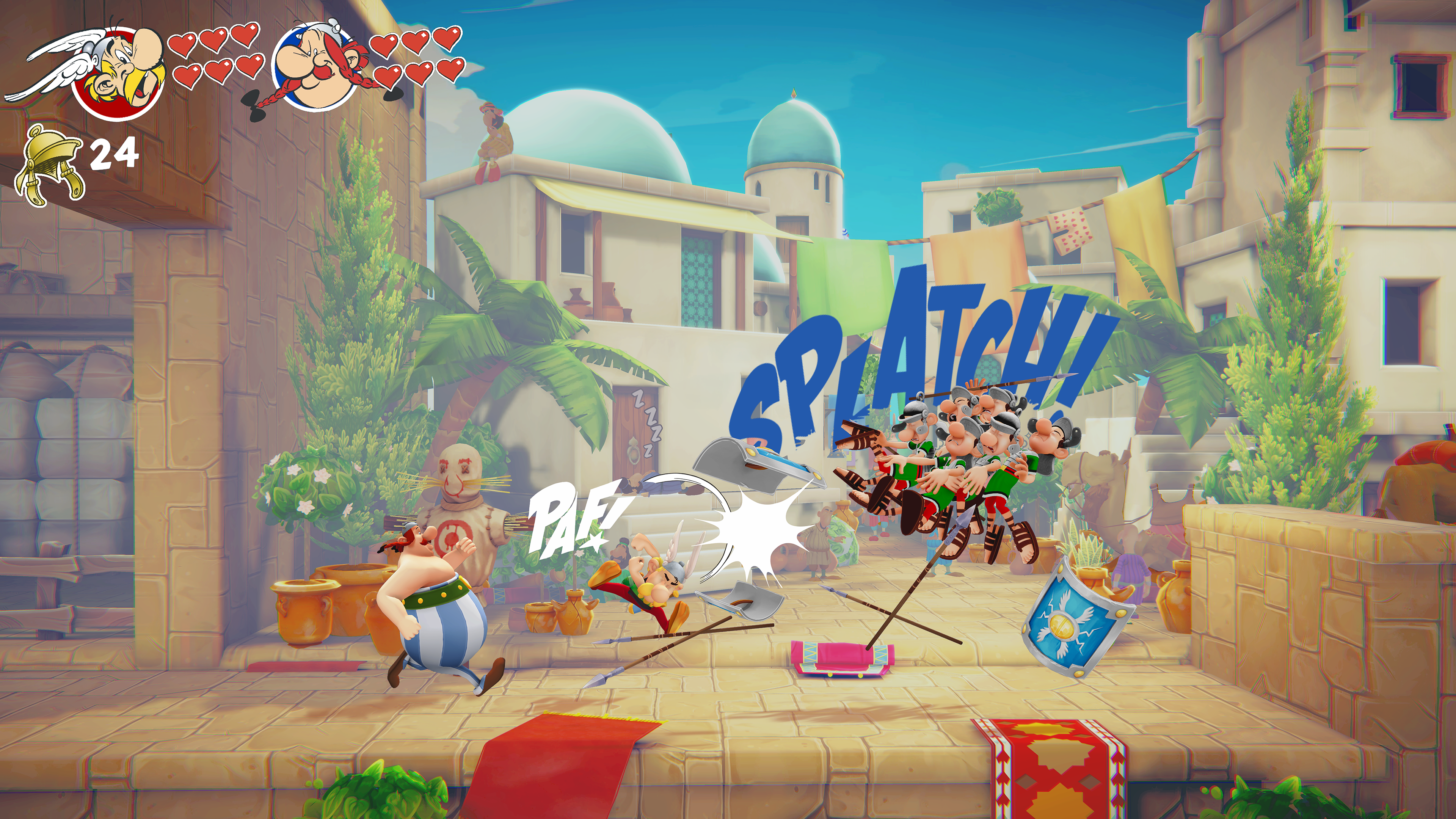 Astérix y Obélix en acción. Astérix patea. Los soldados son golpeados. Edificios al fondo. ¡SPLAT! y ¡PAF! en la imagen.