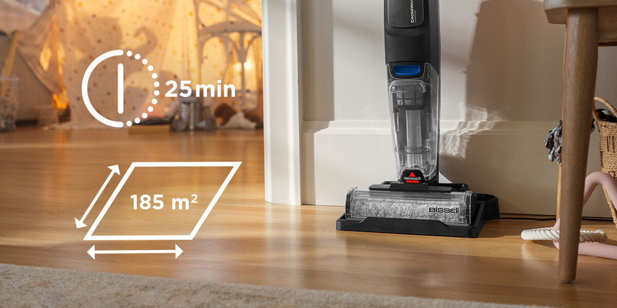 Czarny i szary odkurzacz Bissell CrossWave stoi na drewnianej podłodze. Grafika pokazuje 25 min i 185 m² czasu i powierzchni czyszczenia.