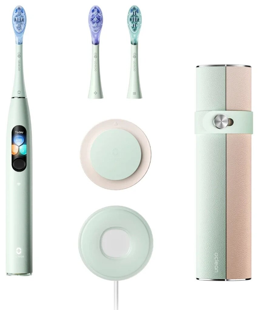 Zestaw elektrycznej szczoteczki do zębów z trzema główkami, stacją ładującą i etui podróżnym, wszystko w pastelowej zieleni i różu.