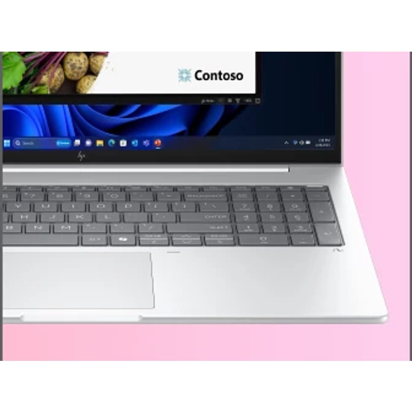 Laptop mit Tastatur, Bildschirm mit Contoso-Fenster und Gemüse-Hintergrund. Rosa Hintergrund.