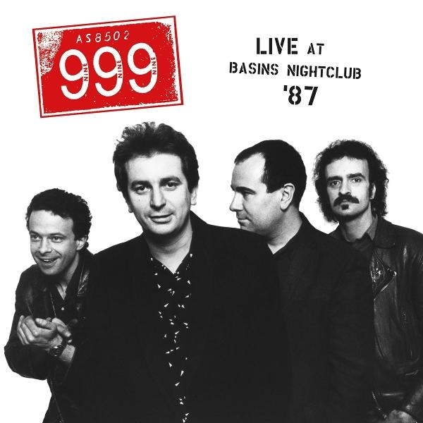 Bandfoto: Vier Männer, einer vorne, andere hinten. Rotes quadratisches Logo '999'. Text: Live at Basins Nightclub '87.