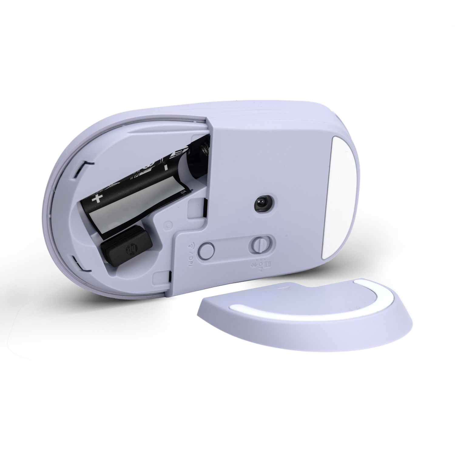 A light purple mouse has its battery compartment open, showing a battery and a receiver. The cover is detached.