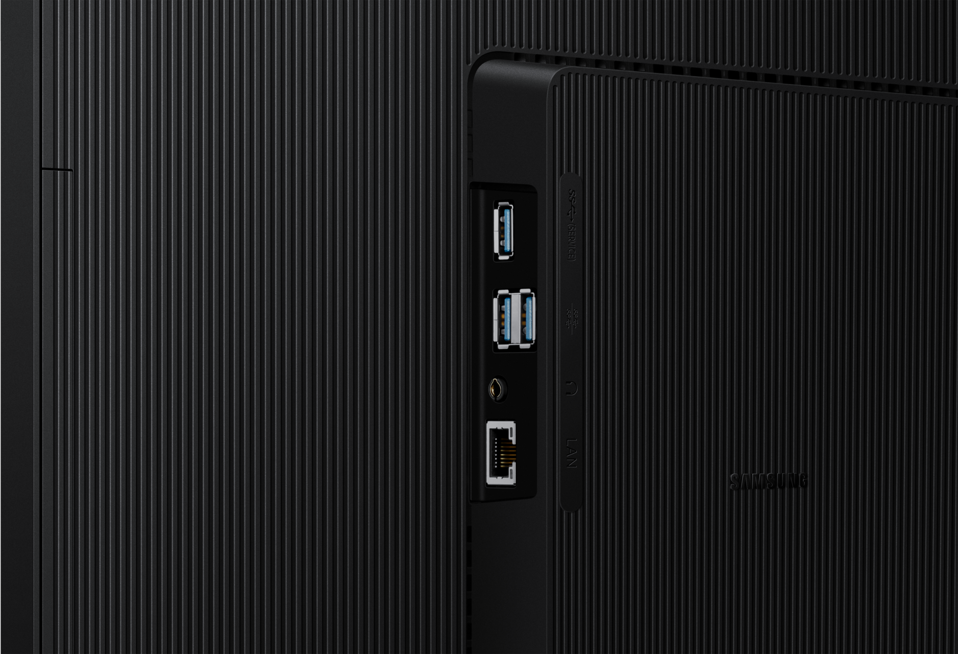 Panneau arrière noir d'un appareil Samsung avec ports USB et LAN. Lignes verticales et logo Samsung.