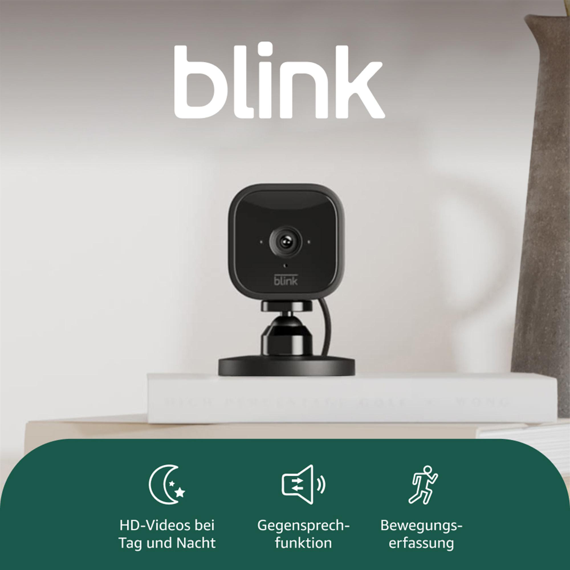 Eine schwarze Blink-Überwachungskamera auf einem Ständer. Weißes 'blink'-Logo darüber. Funktionen für Nachtsicht, Zwei-Wege-Audio und Bewegungserkennung.