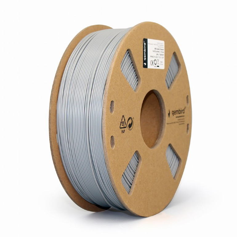 Egy szürke filament orsó 3D nyomtatáshoz középen. Az orsó barna karton alapon van. Egy címke látható jobbra.