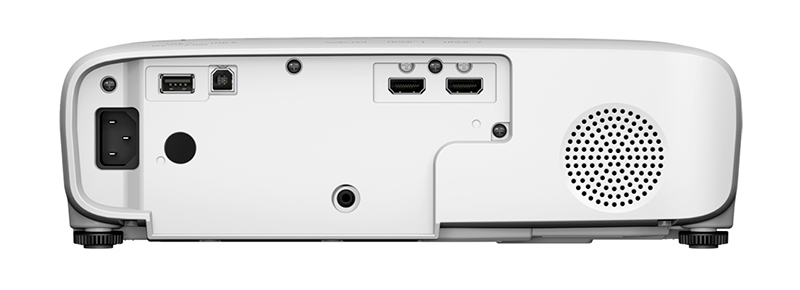 HDMI, USB ve güç dahil olmak üzere çeşitli bağlantı noktalarına sahip beyaz projektör arkası. Sağ tarafta dairesel bir hoparlör havalandırması.