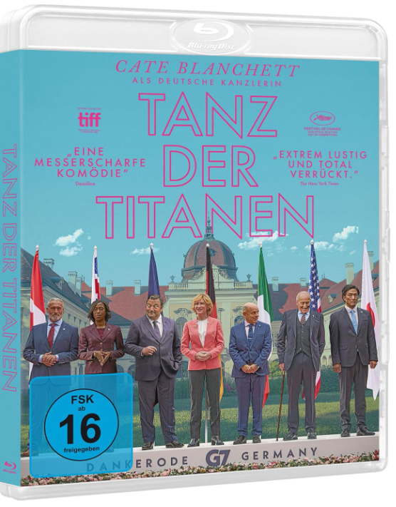 Blu-ray-Cover für 'Tanz der Titanen'. Cate Blanchett als deutsche Kanzlerin. Gruppe von Personen vor einem Gebäude mit Fahnen.