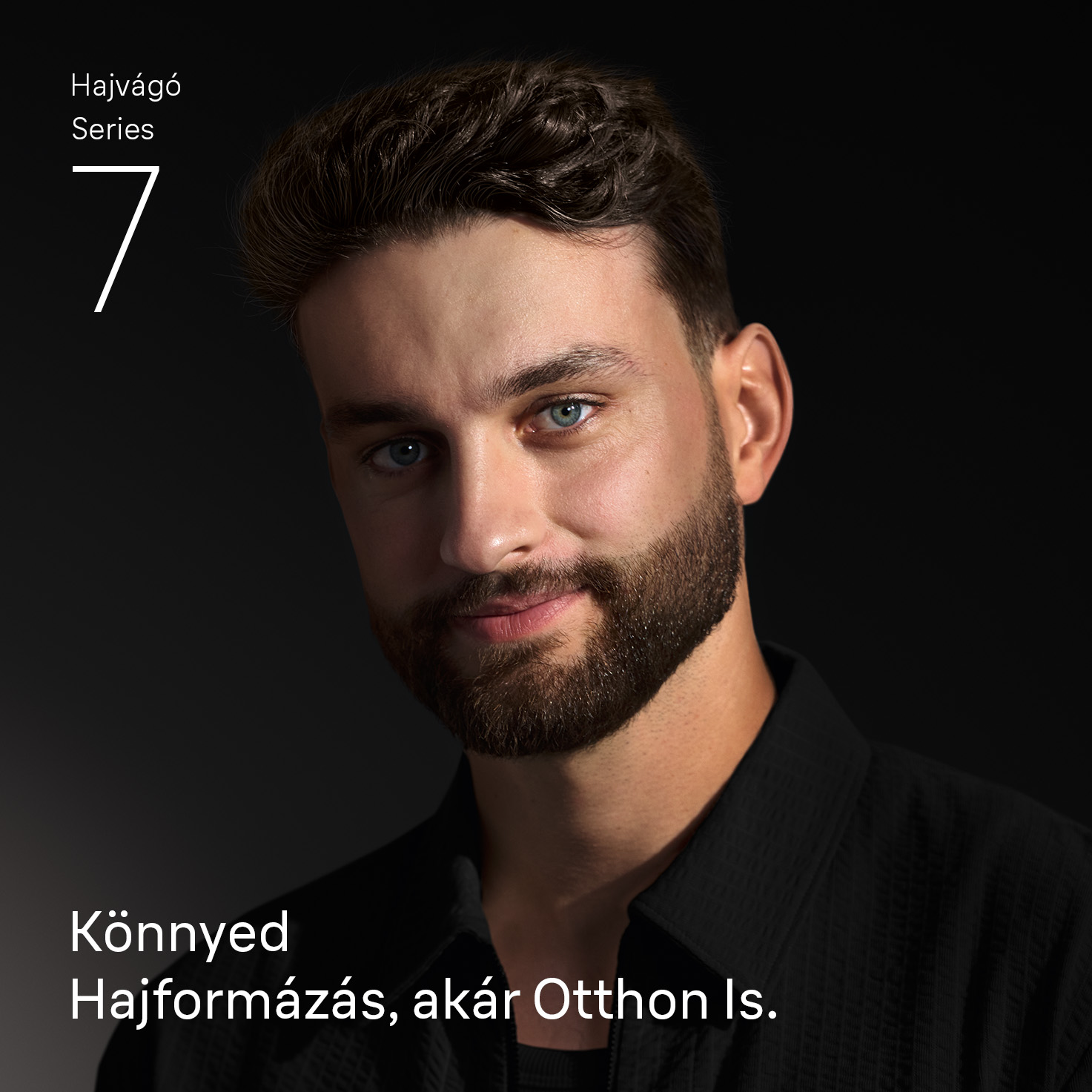 Férfi szakállal és kék szemekkel. Szöveg: Hajvágó Series 7, Könnyed Hajformázás, akár Otthon Is.