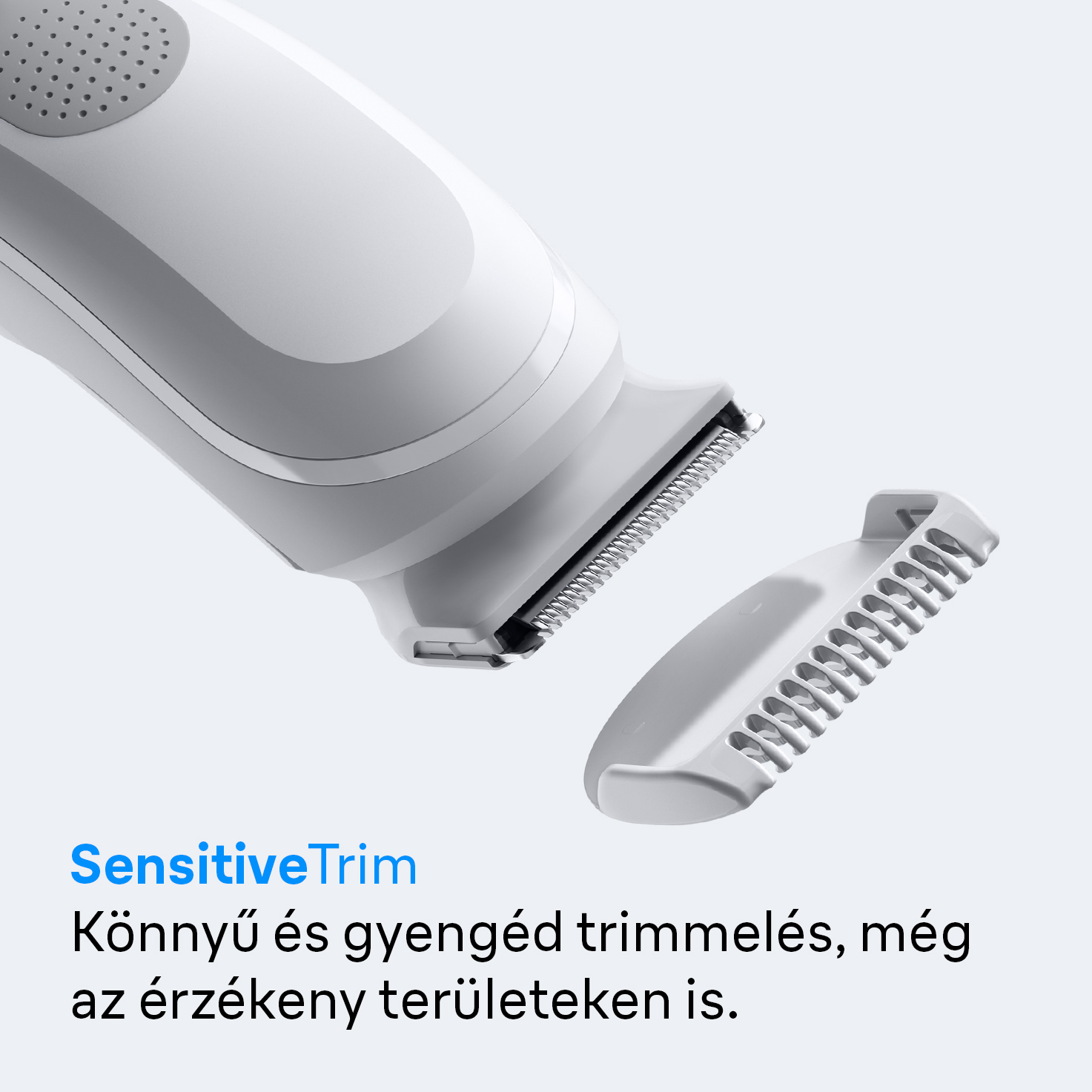 Fehér elektromos trimmer, levehető fésű toldalékkal. 'SensitiveTrim' felirat és alatta magyar szöveg.
