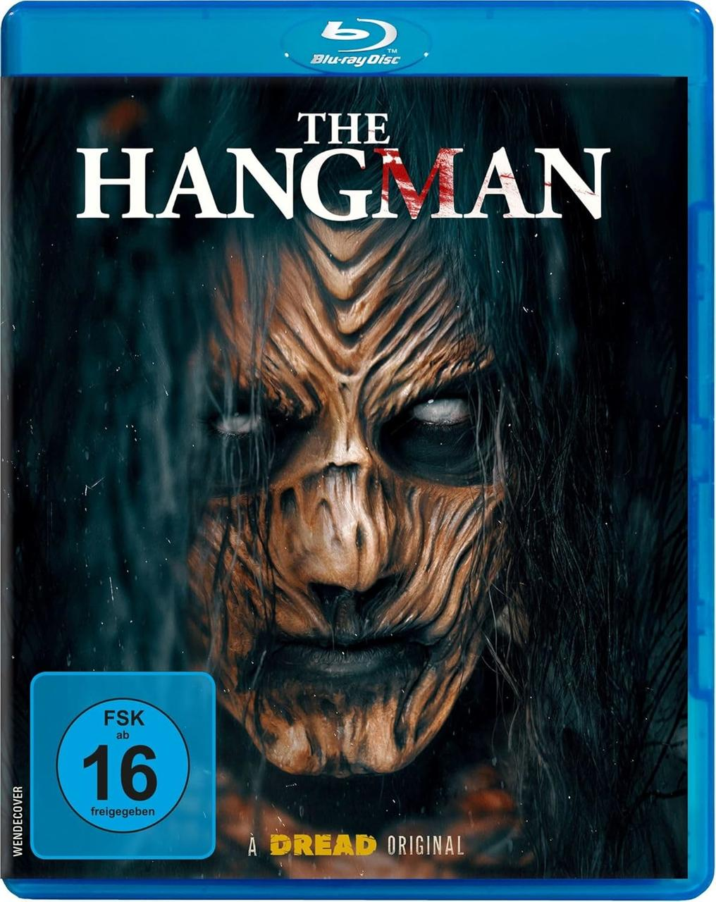 Blu-ray-Disc-Cover für 'The Hangman'. Zeigt eine Nahaufnahme eines grotesken Gesichts, dunkles Haar und ein blaues Bewertungsetikett.