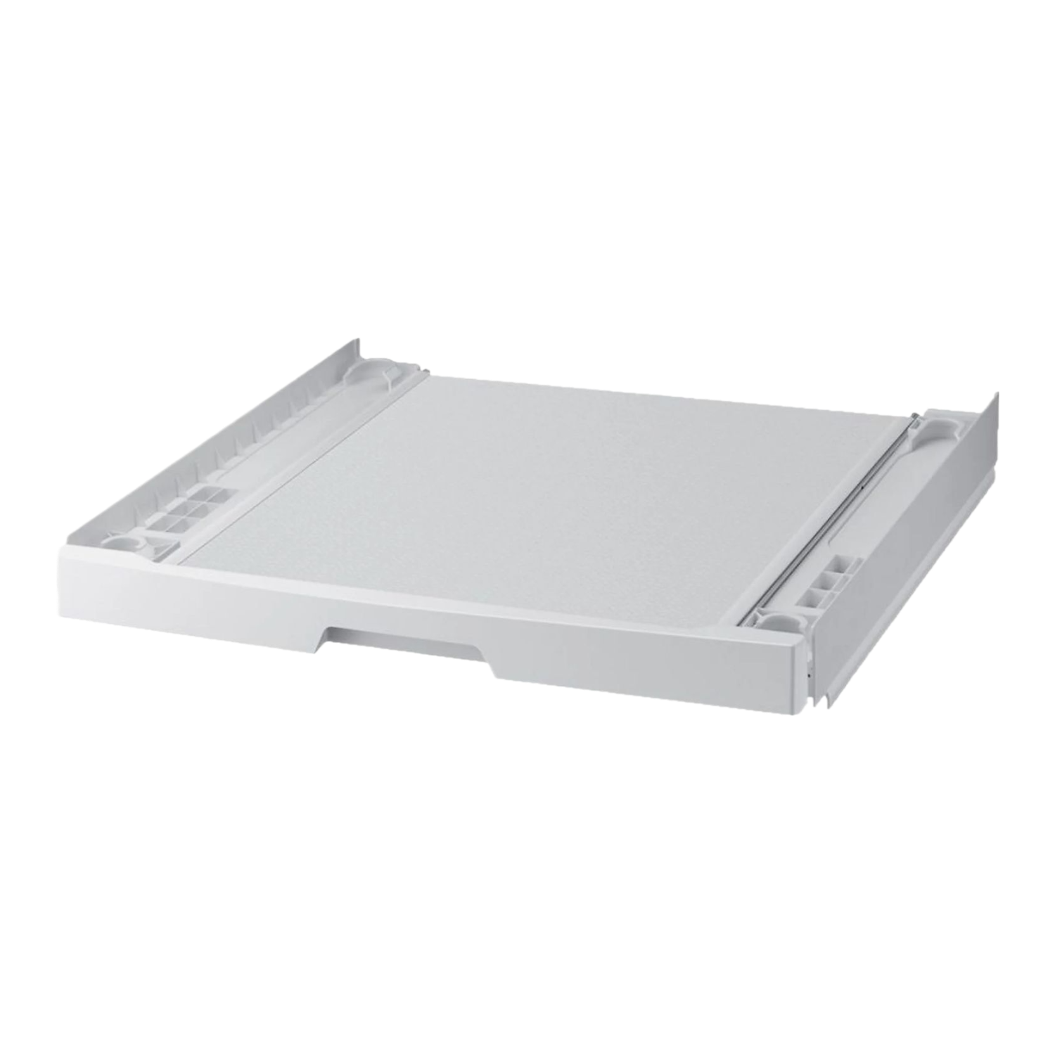 Un socle de machine à laver blanc et rectangulaire sur fond noir. Il a un dessus plat et des rails latéraux avec de petits compartiments.