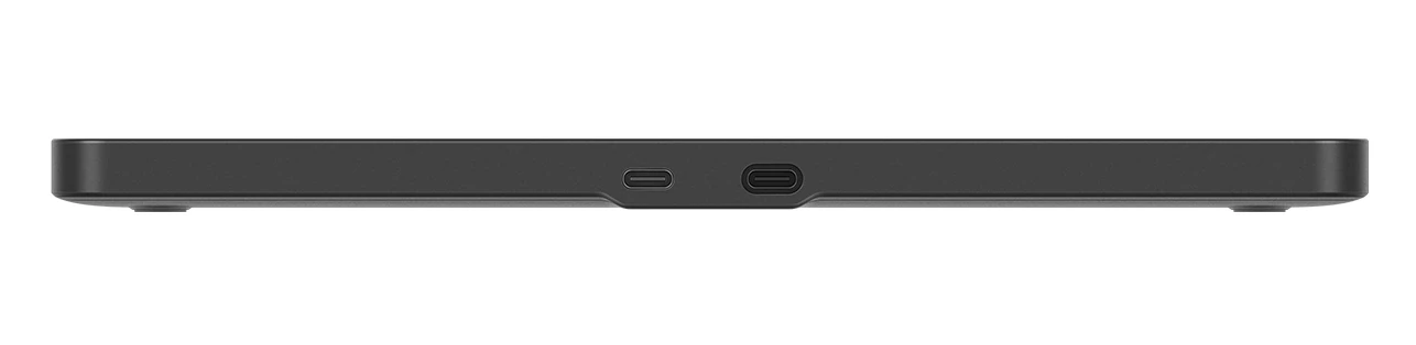 Czarny, prostokątny przedmiot, prawdopodobnie hub, z dwoma portami USB-C. Leży na białej powierzchni.