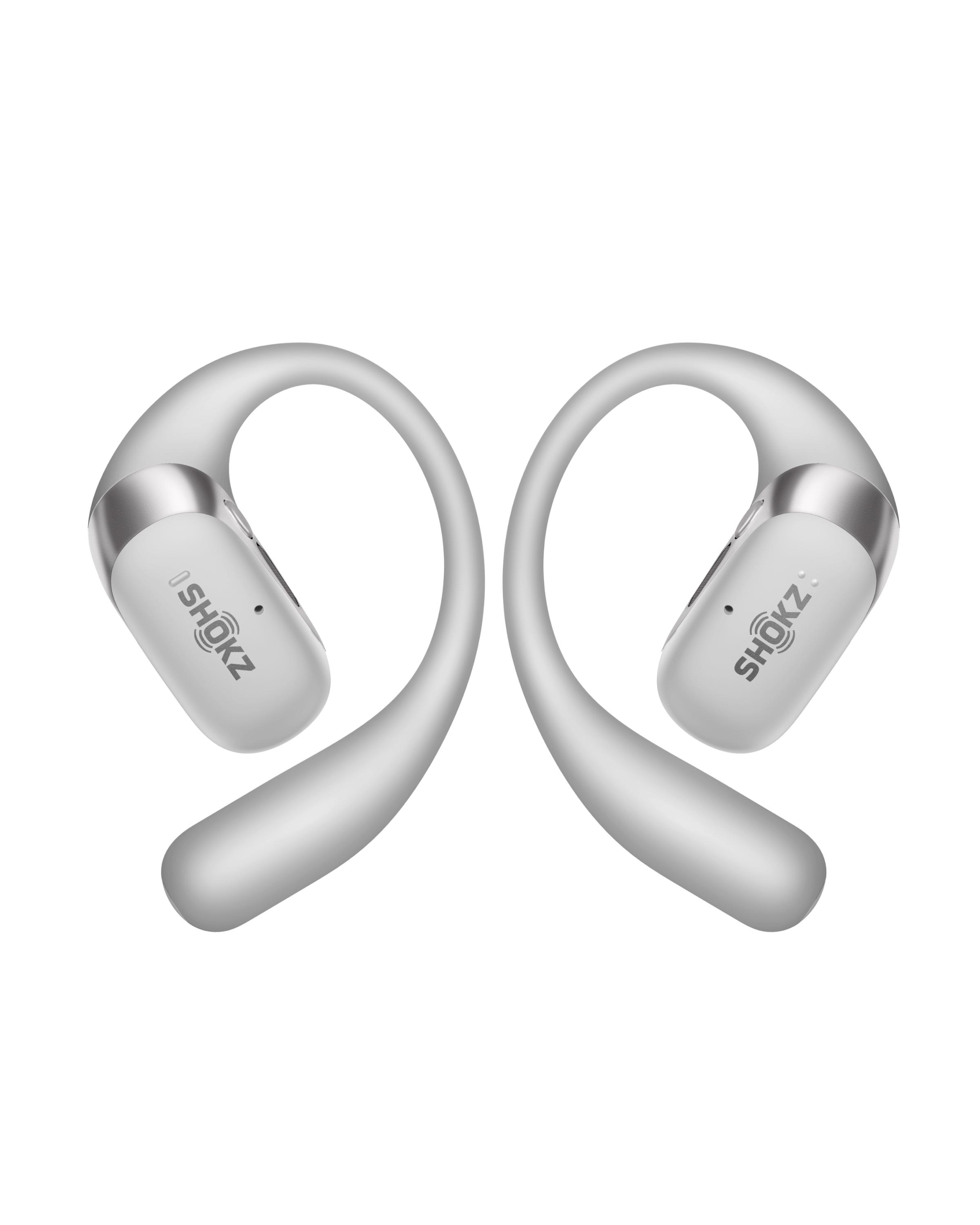 Zwei weiße Knochenschall-Kopfhörer auf weißem Hintergrund. Jeder hat ein SHOKZ-Logo auf dem Körper.