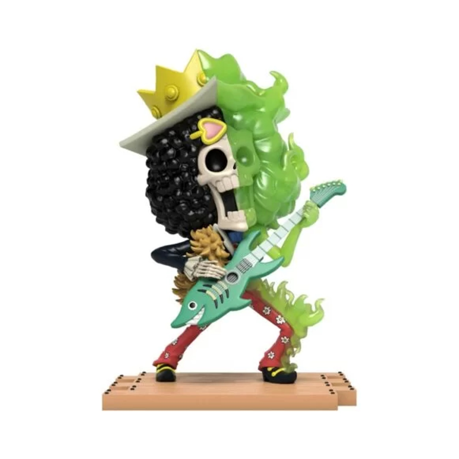 Una figura di scheletro con corona e cappello suona una chitarra verde. Ha capelli neri ricci e pantaloni rossi. Fiamme verdi lo circondano.