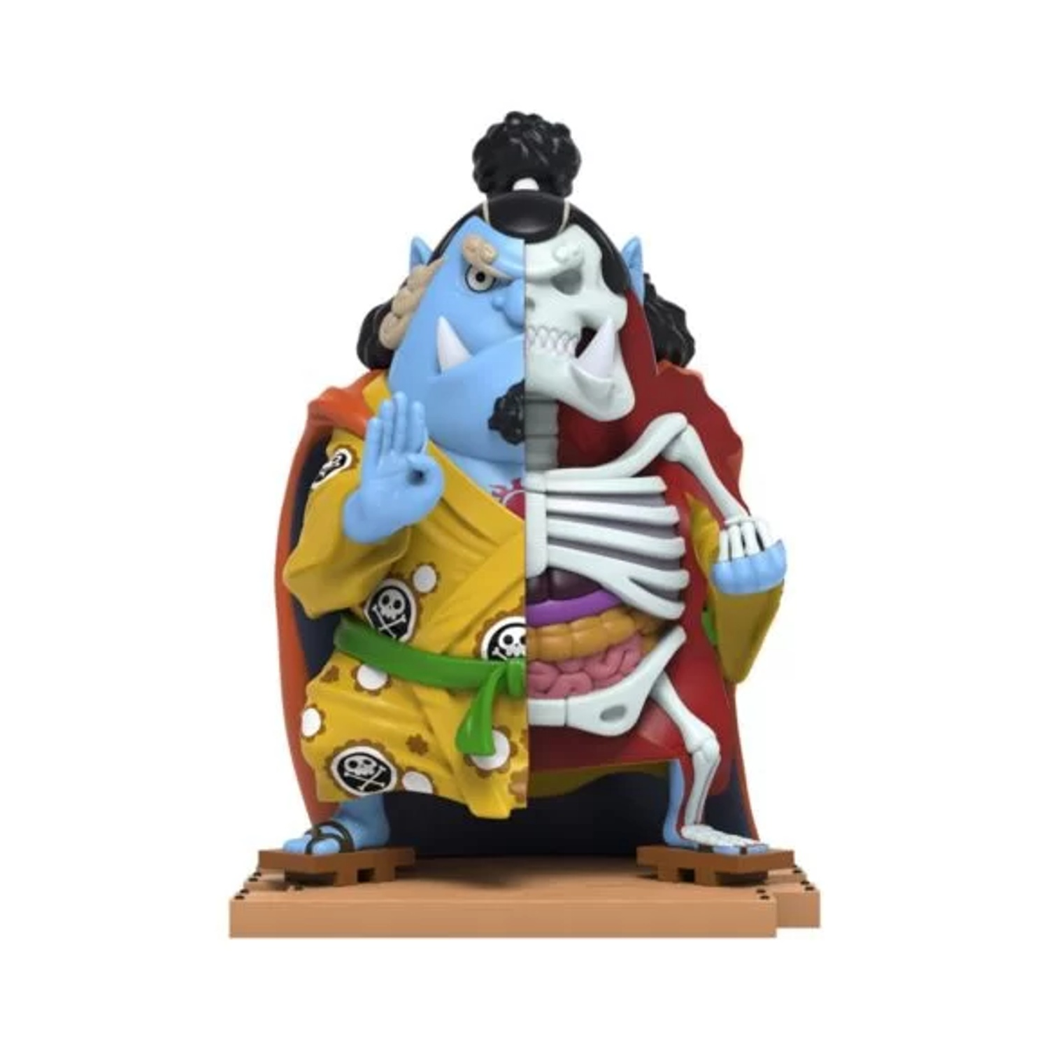 Una figura con metà pelle e metà scheletro. Il lato con la pelle ha pelle blu, veste gialla e un gesto della mano. L'altra metà mostra le ossa.