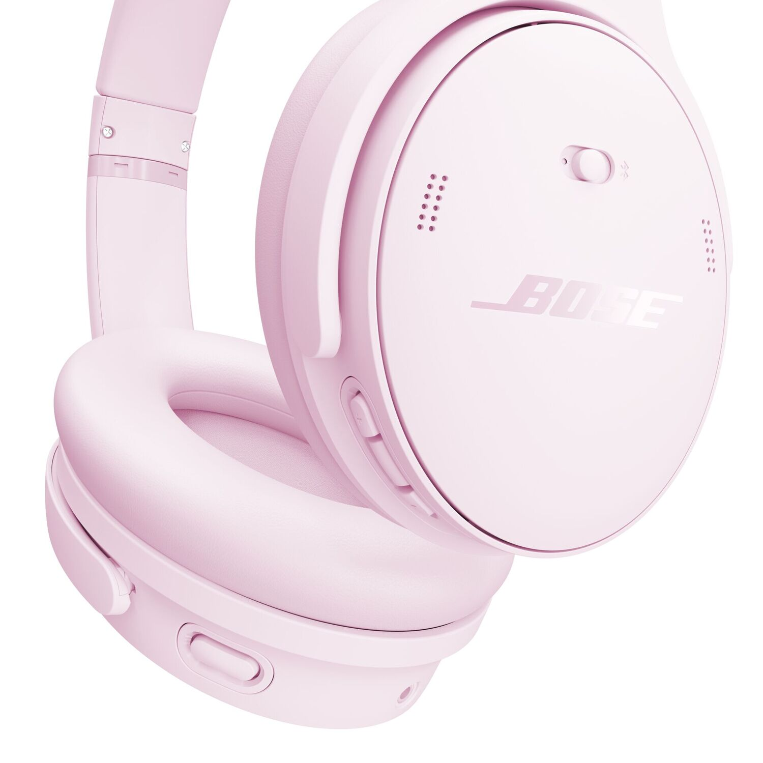 Een roze Bose-koptelefoon. De koptelefoon staat tegen een witte achtergrond. Het merk is zichtbaar.
