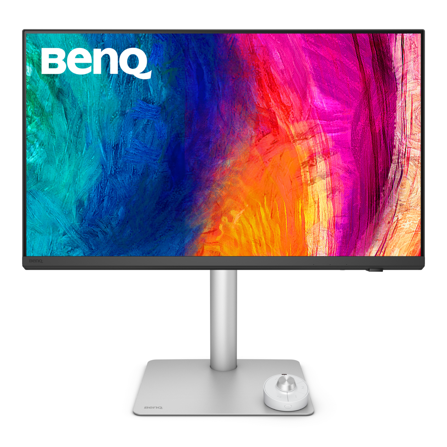 A computer monitor with a colorful abstract background, a white stand, and a white control dial on a black surface.