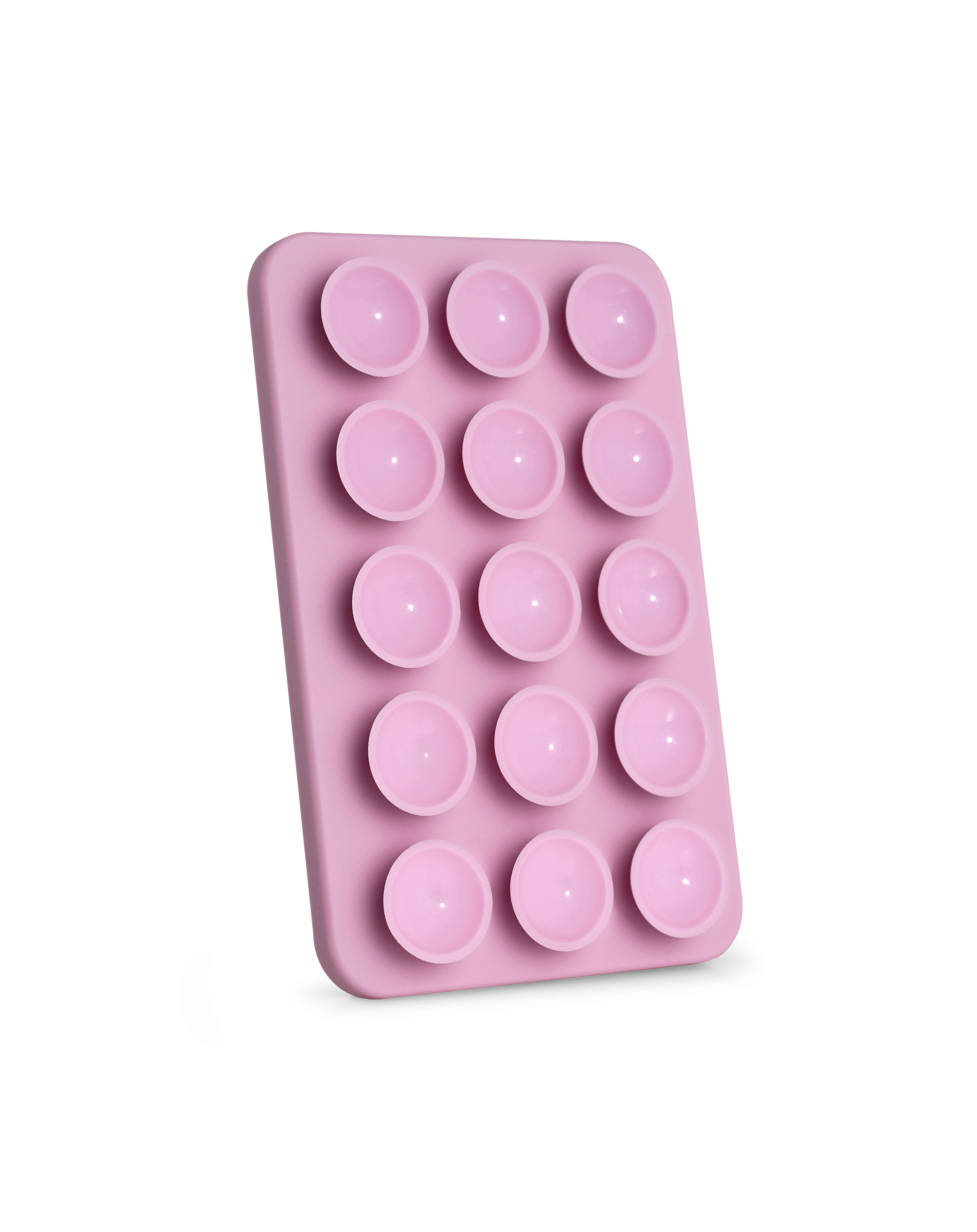 Rosa Silikonform mit 15 kreisförmigen Vertiefungen. Sie hat eine rechteckige Form, auch die Vertiefungen sind rosa.