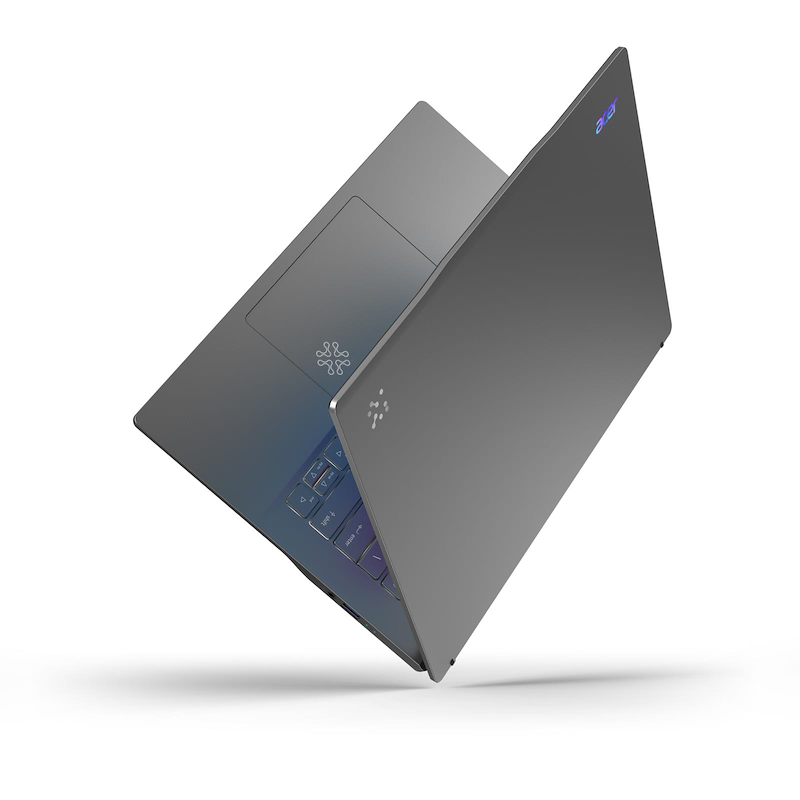 Una computadora portátil gris está abierta. El teclado es visible con teclas iluminadas. El logotipo de Acer está en la parte superior.