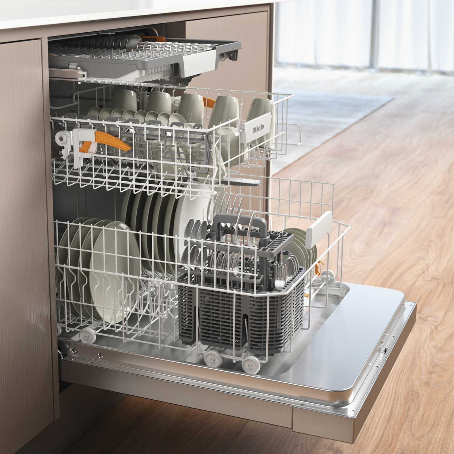 An open dishwasher with dishes and cups inside. The door is open, revealing the racks. Wooden floor is in the background.