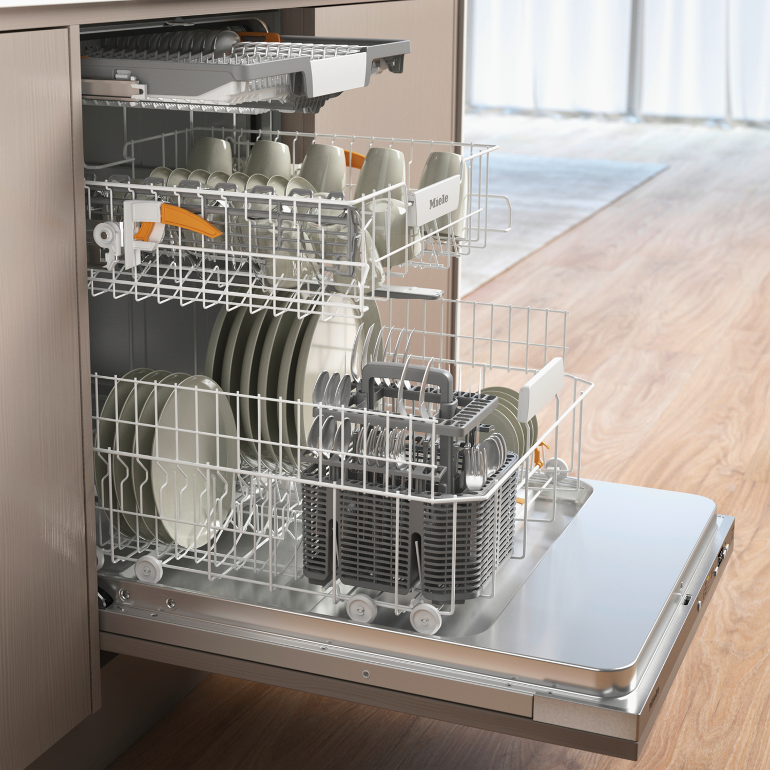 An open dishwasher with dishes, cups, and cutlery. The interior is stainless steel. The background shows wood flooring and a window.