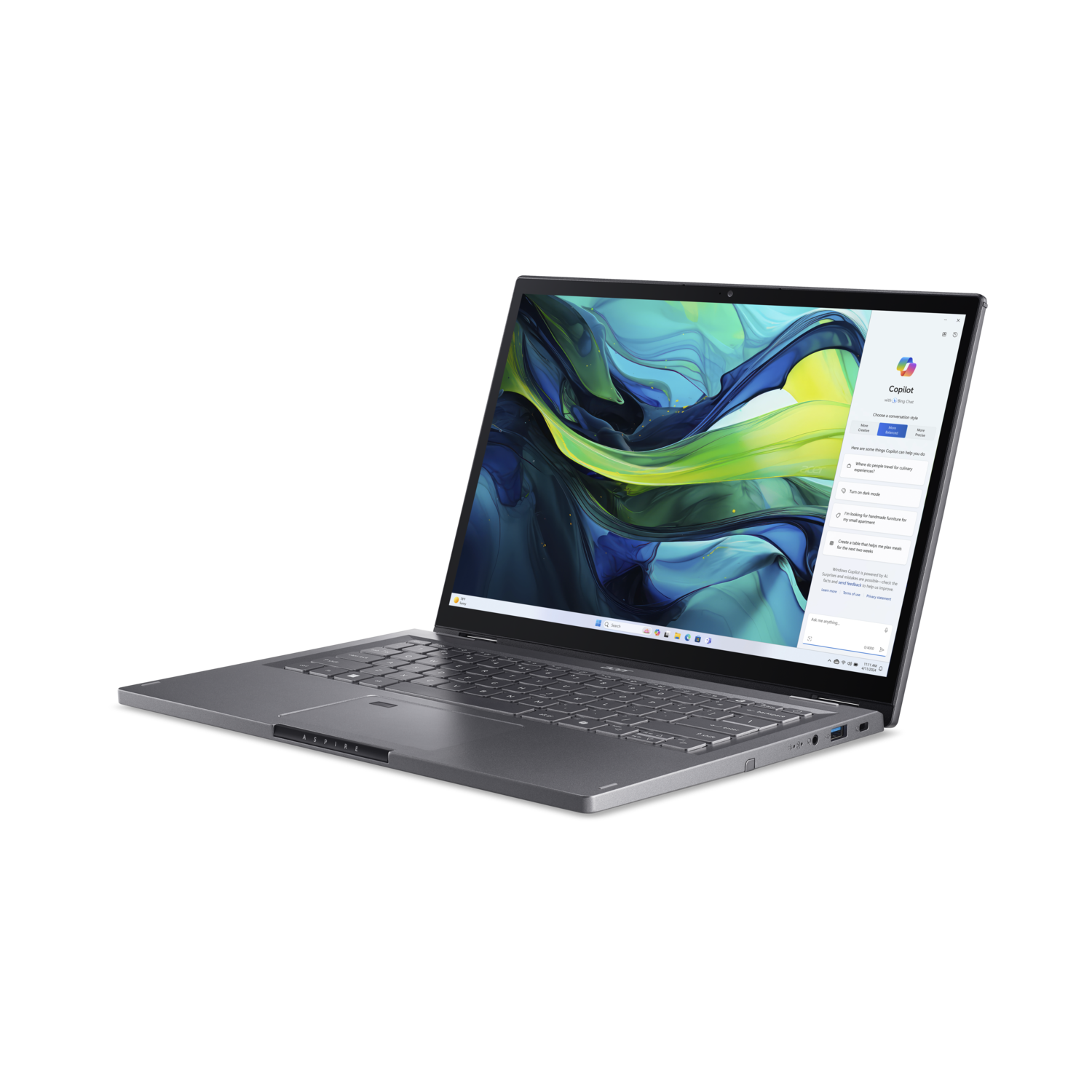 A silver laptop is open on a black surface. The screen displays a user interface with text and graphics.