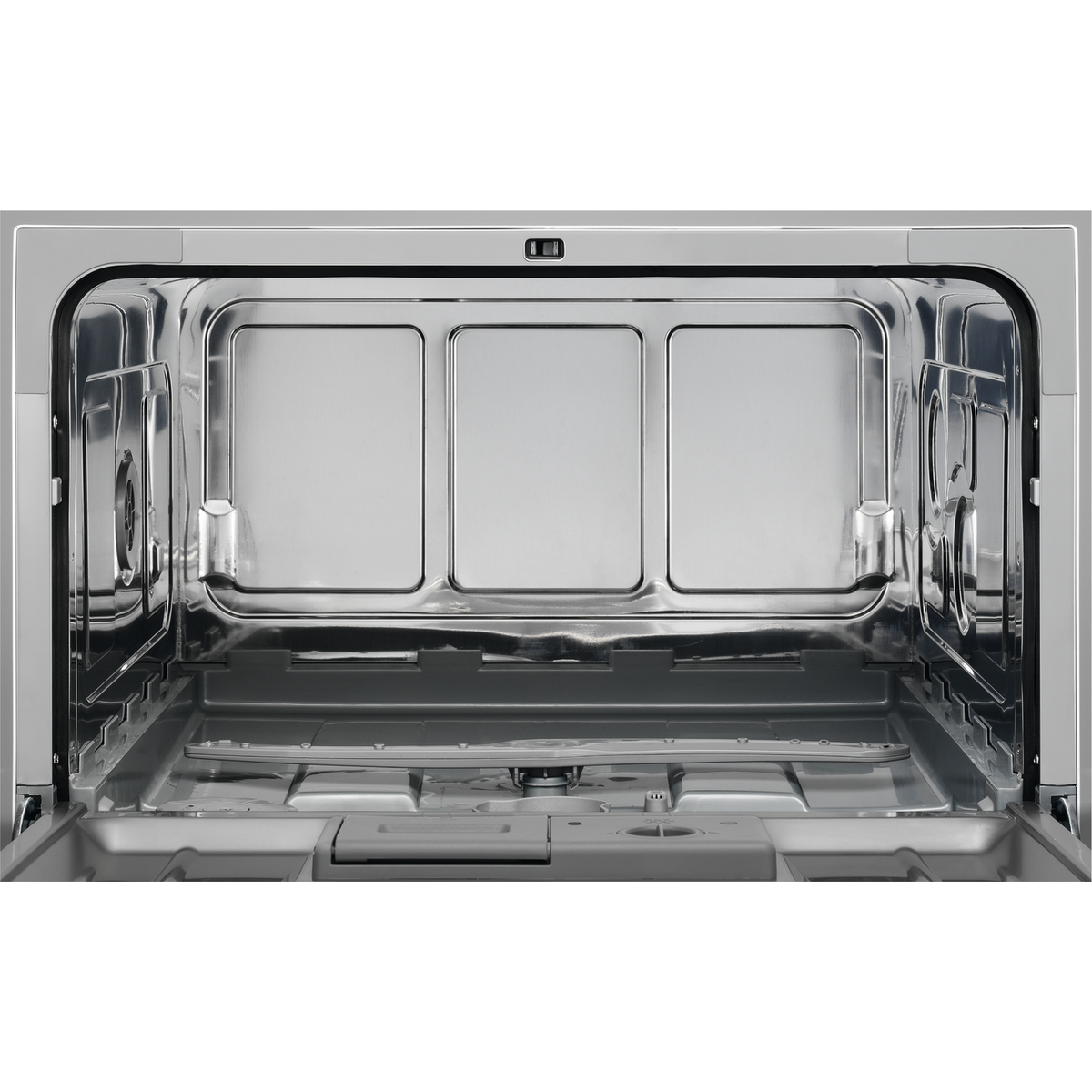 Wnętrze zmywarki ze stali nierdzewnej. Wnętrze jest puste z trzema prostokątnymi przegrodami na górze.
