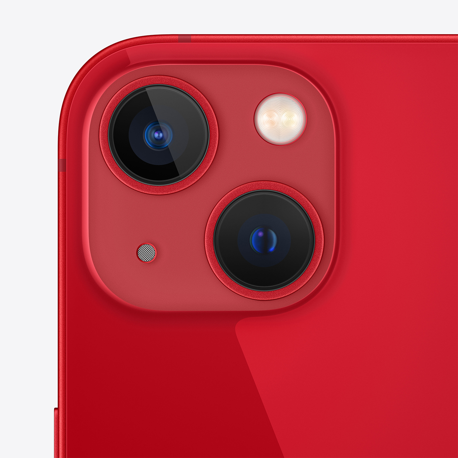 Primo piano del modulo fotocamera di uno smartphone rosso con due lenti, un flash e un microfono. Il telefono ha un bordo curvo.
