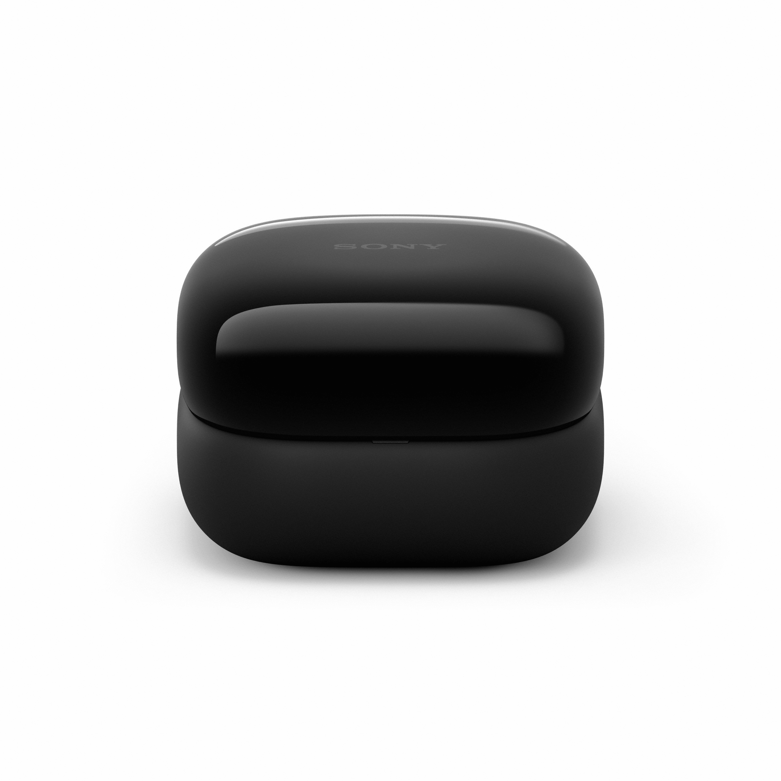 Un étui de chargement noir pour écouteurs Sony sur une surface blanche. Le dessus est brillant, avec le mot SONY.