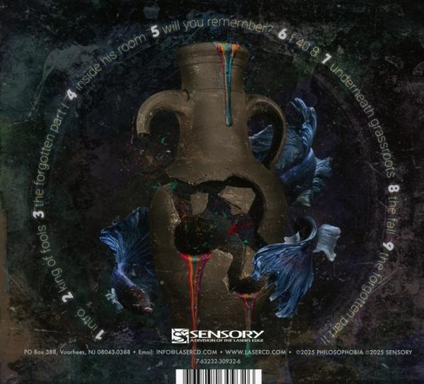 Eine zerbrochene Vase mit bunten Tropfen und fischartigen blauen Formen auf dunklem Hintergrund. Text enthält Songtitel und Sensory-Logo.