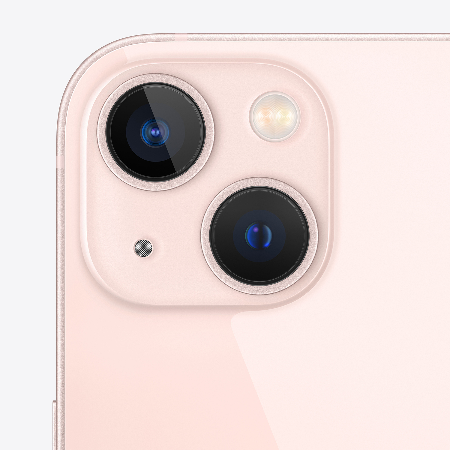 Primo piano del modulo fotocamera di uno smartphone rosa. Sono visibili due lenti, un flash e un microfono. Lo sfondo è rosa.