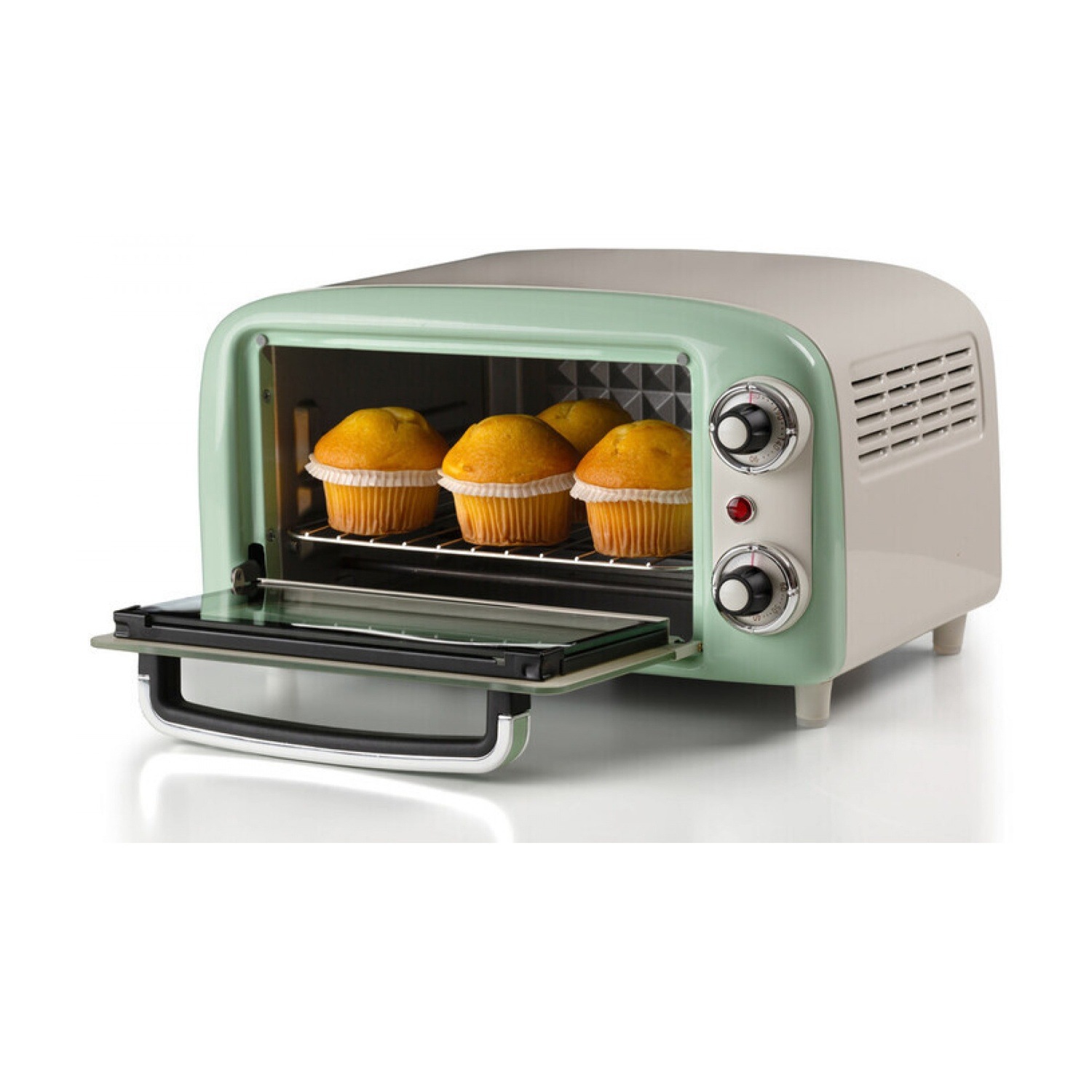 Un forno in stile retrò con muffin all'interno. Il forno è bianco e verde, con una porta a vetri aperta. Si vedono quattro muffin.