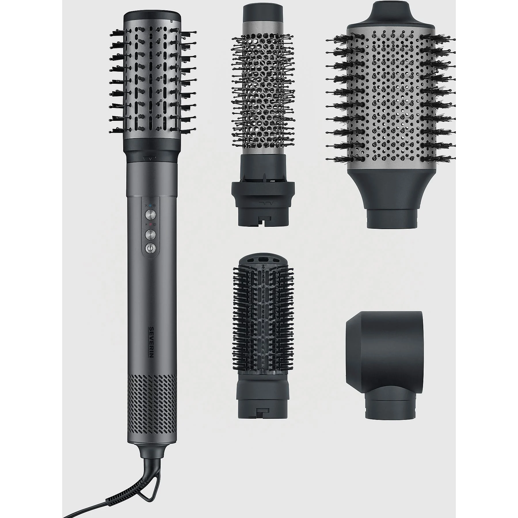 Zestaw narzędzi do stylizacji włosów z wieloma nasadkami. Główna jednostka jest szara, a nasadki czarne.