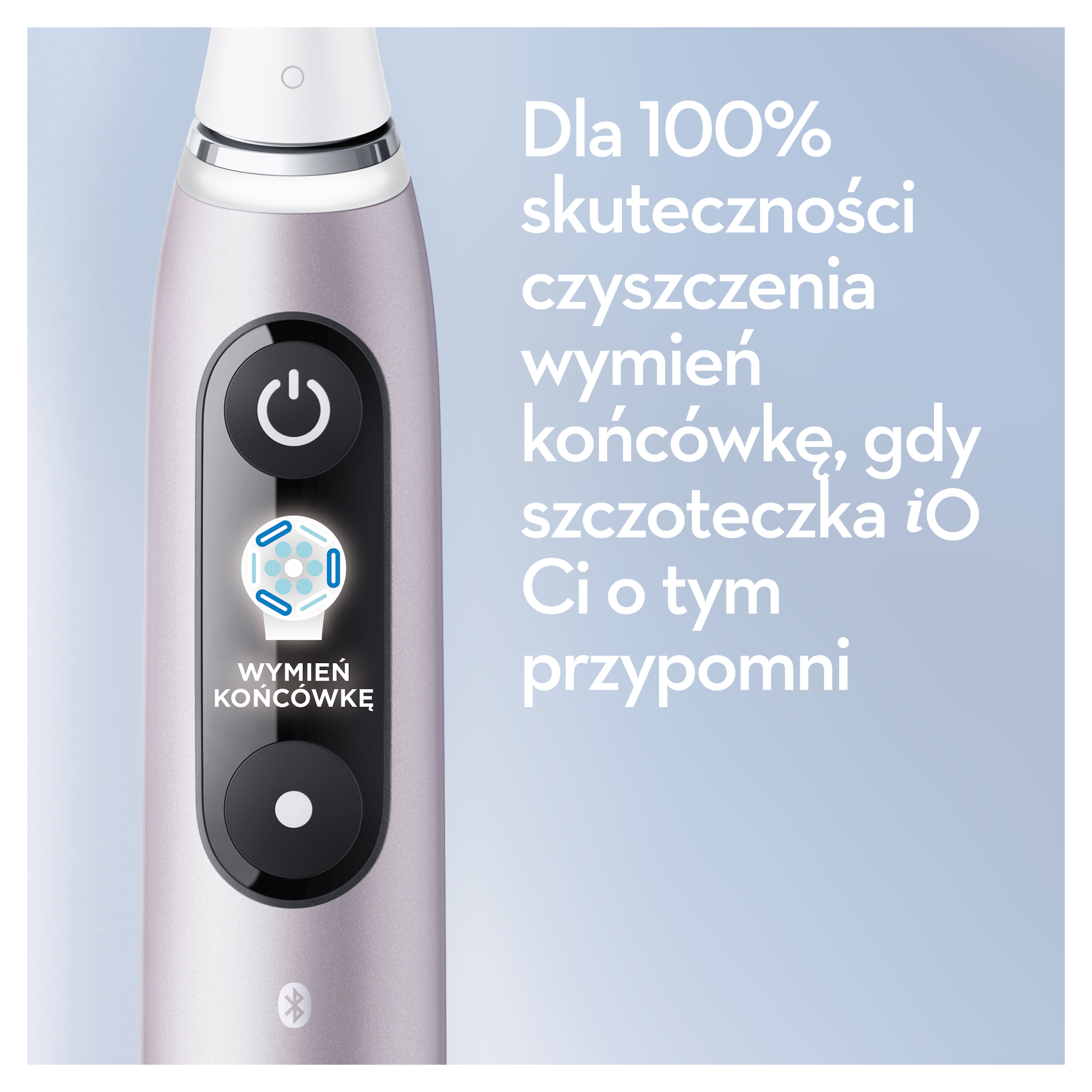 Szczoteczka elektryczna z przyciskiem zasilania i przypomnieniem o wymianie końcówki. Tekst w języku polskim. Jasnoniebieskie tło.