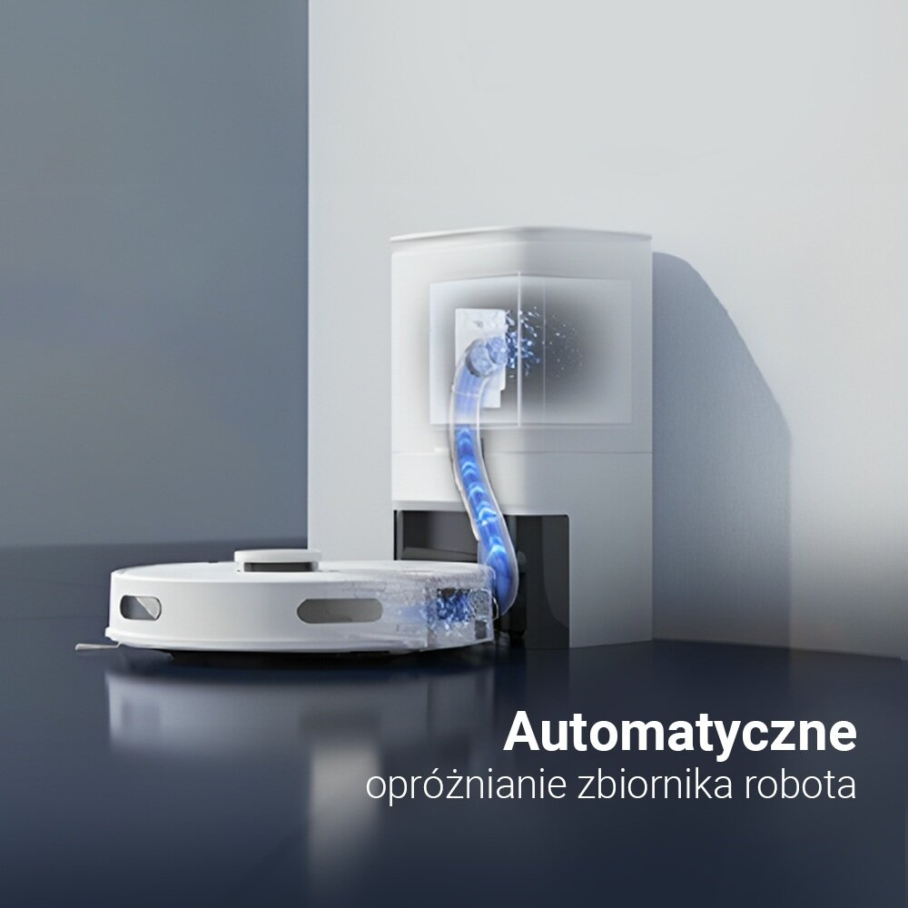 Biały odkurzacz automatyczny opróżnia się do białej stacji ładowania. Niebieski wąż łączy obie części. Tekst: Automatyczne opróżnianie zbiornika robota.