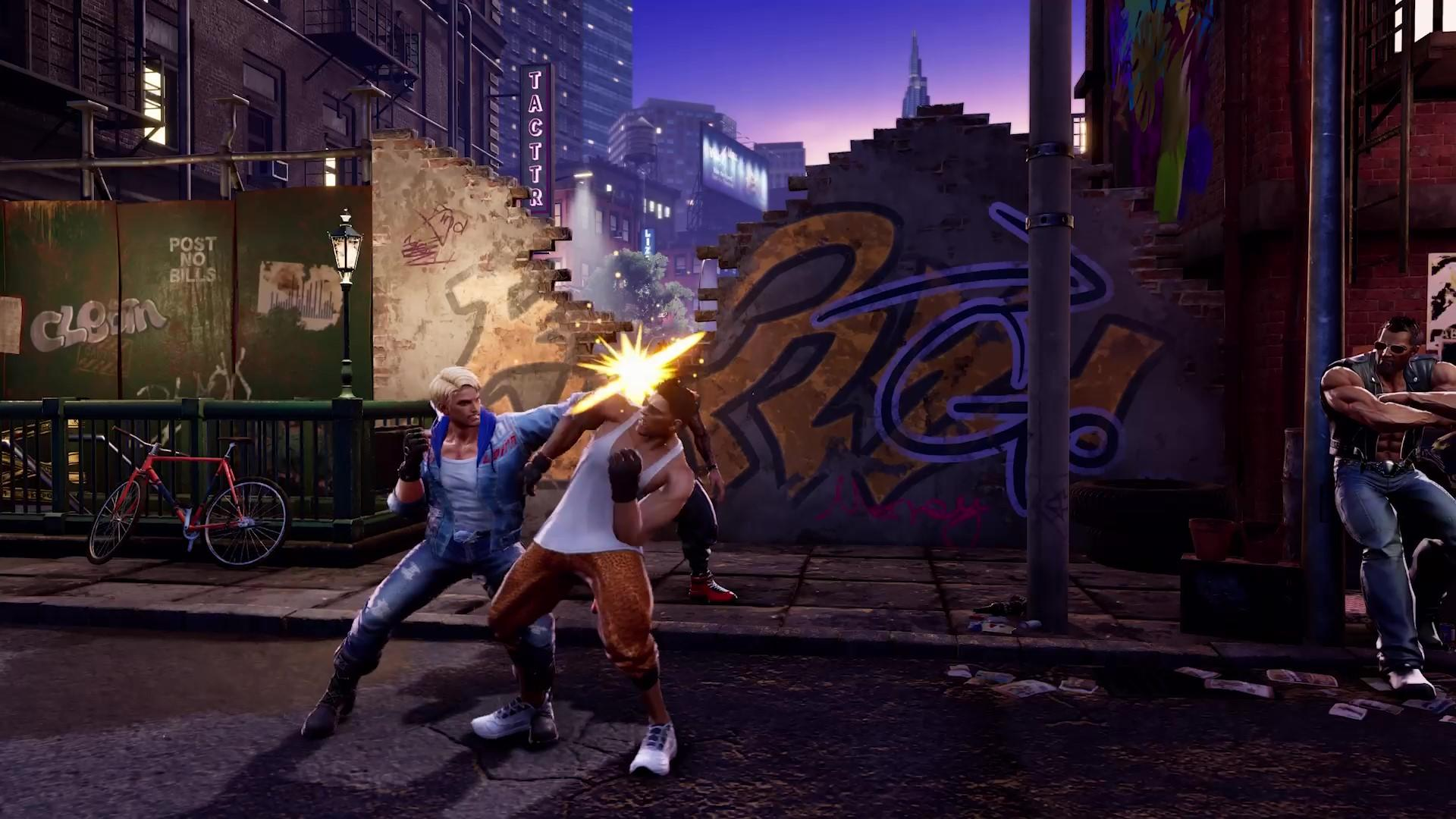 Dwóch mężczyzn walczy na ulicy. Jeden uderza drugiego. Graffiti na ścianie, rower i budynki w tle.