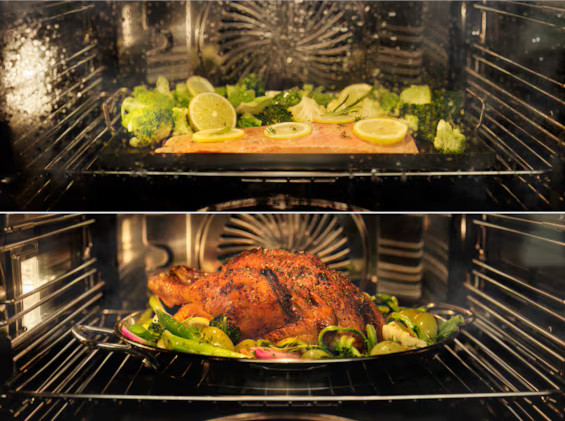 W piekarniku na górze łosoś z cytryną i brokułami. Poniżej pieczony indyk z warzywami.