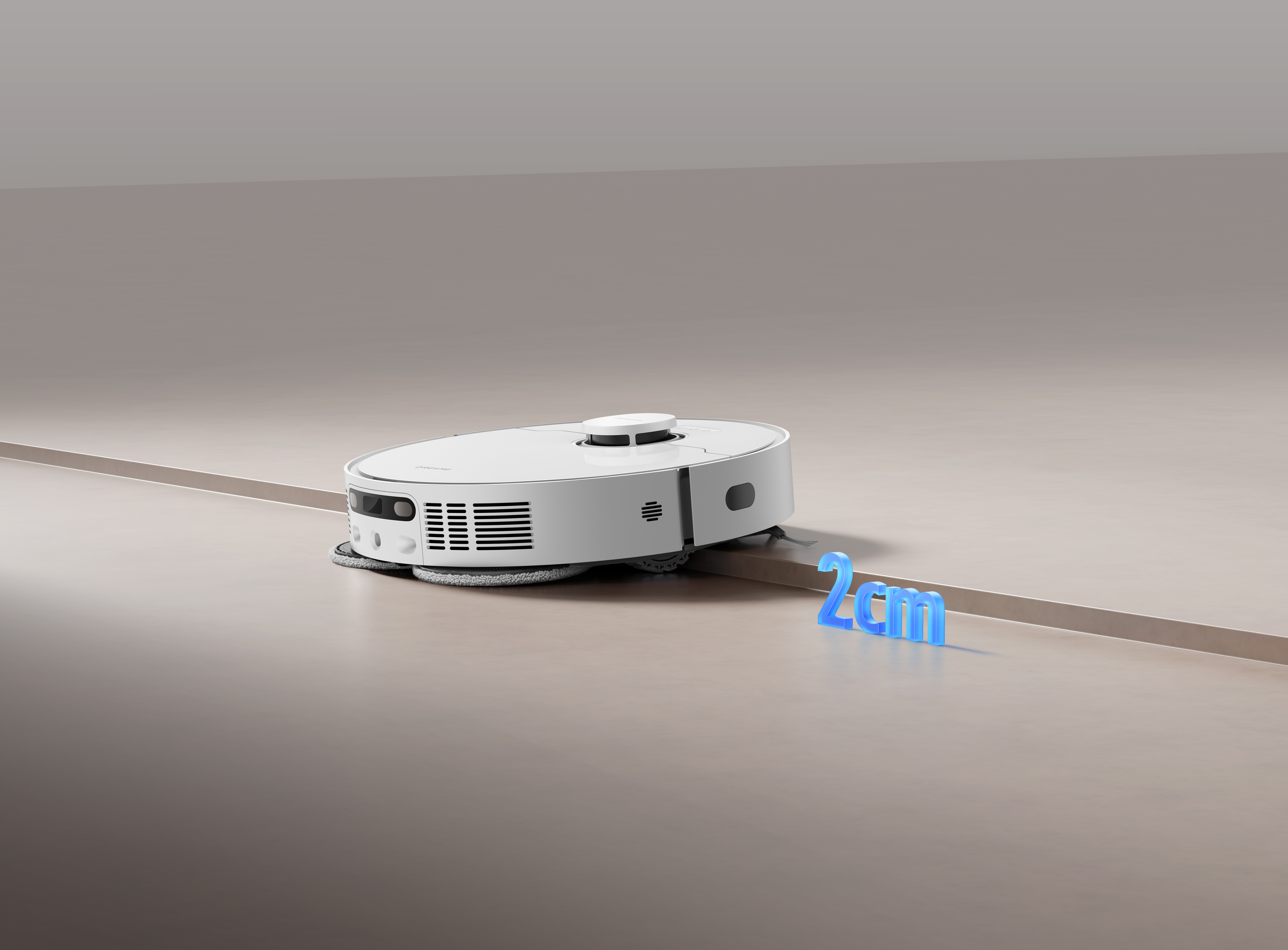 Biały odkurzacz automatyczny na jasnobrązowej powierzchni, z niebieskim tekstem 2cm.