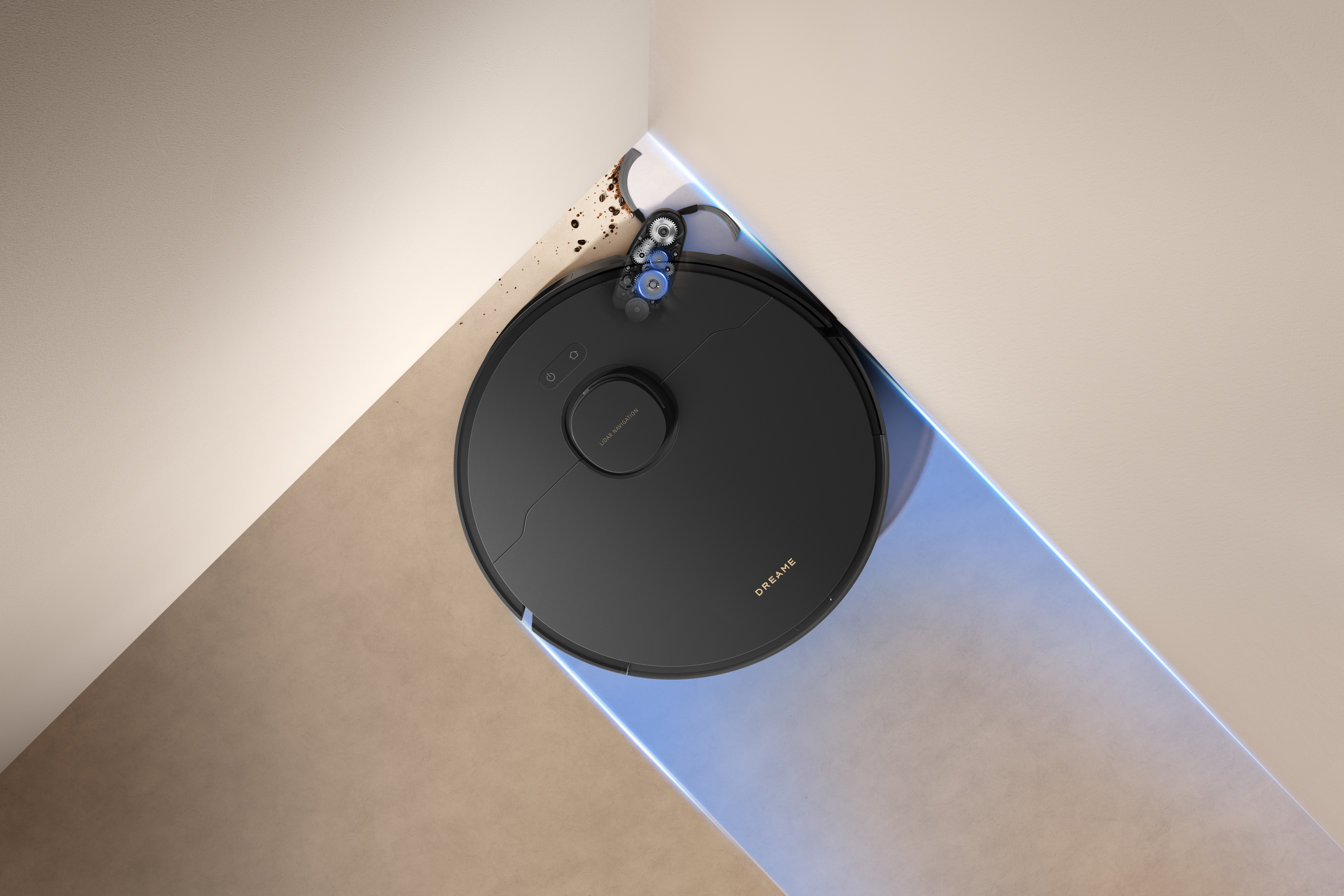 Czarny odkurzacz robot sprząta róg. Scena ma beżowe ściany, niebieskie światło i trochę gruzu.