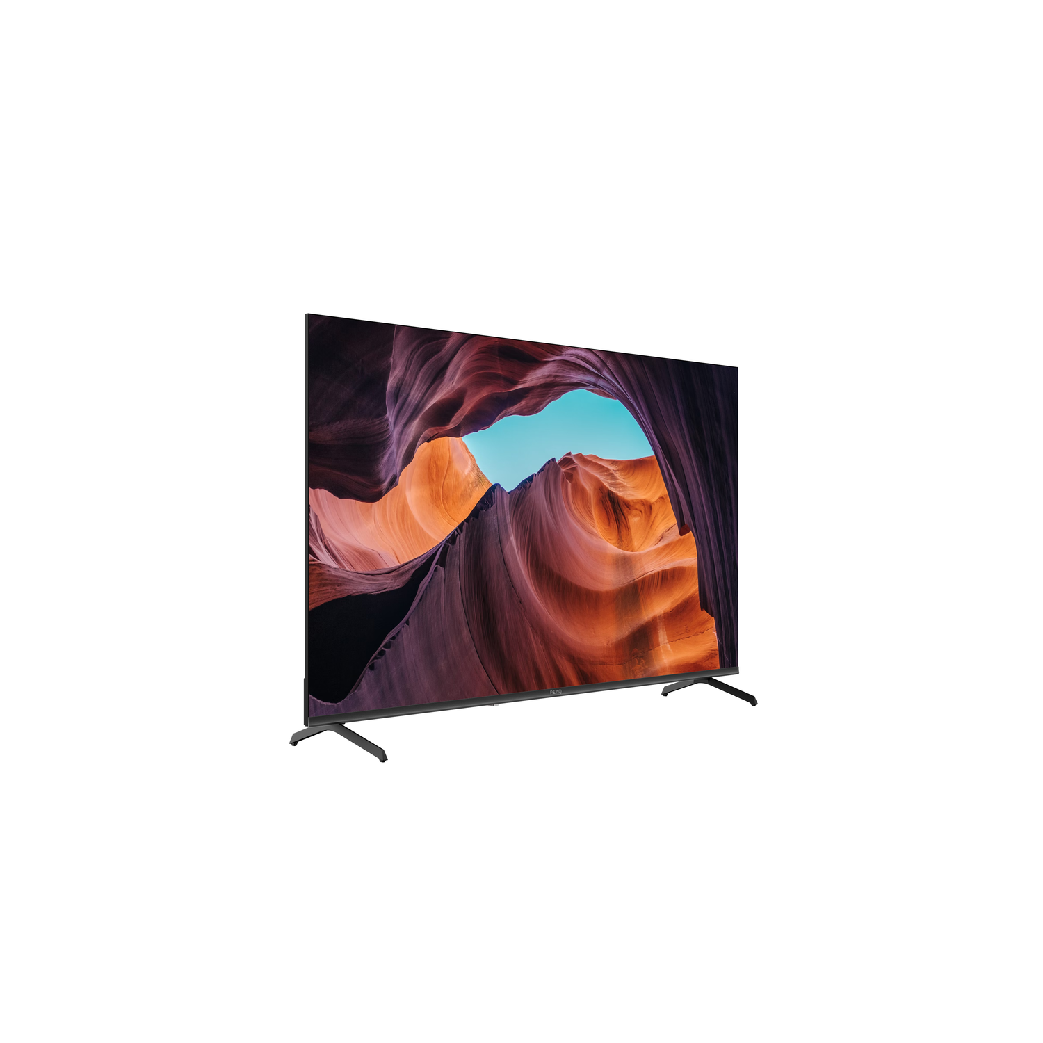 A flat-screen TV displays a canyon scene with orange and purple rock formations under a blue sky. The TV has black legs.