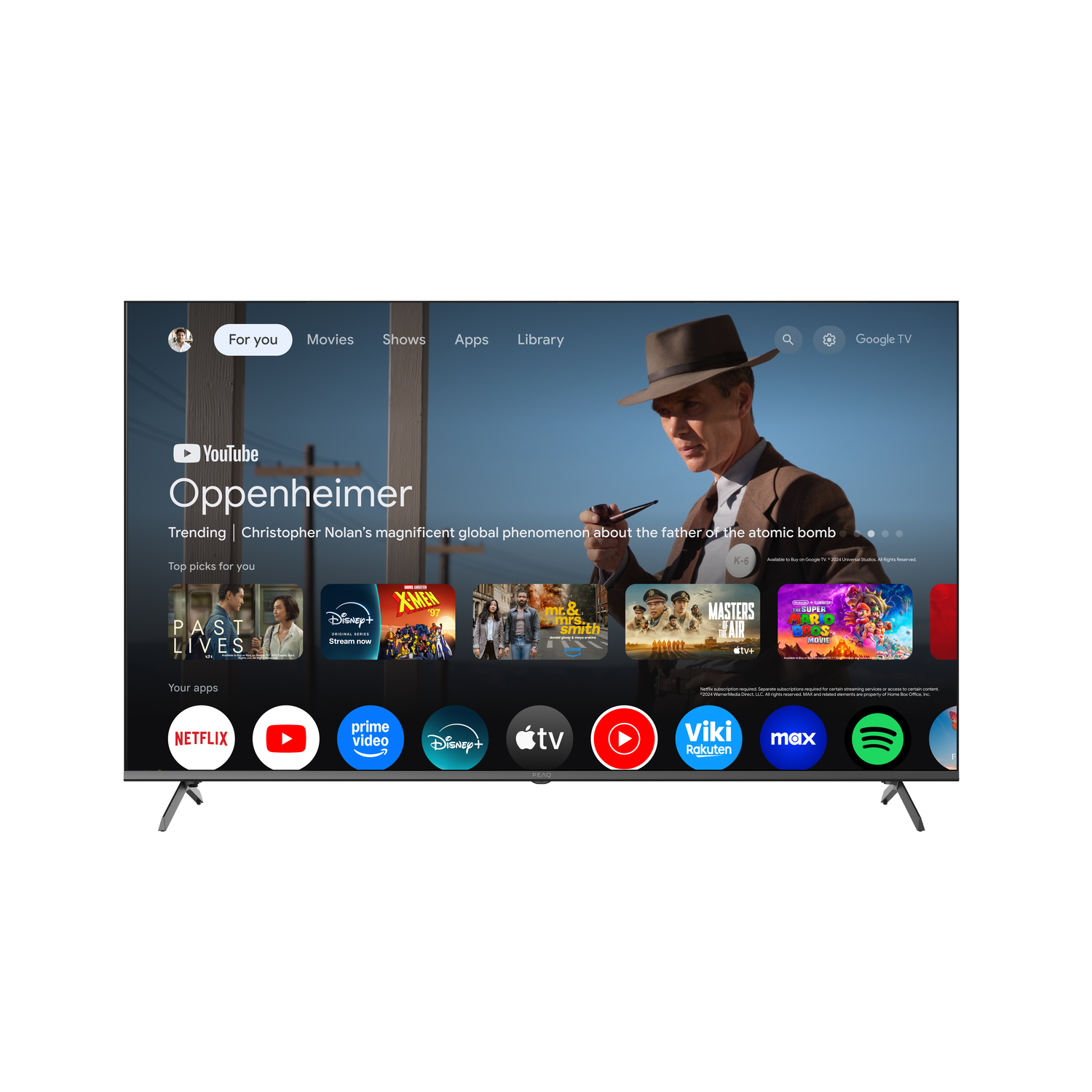 A flat-screen TV displays the YouTube homepage with Oppenheimer. Apps like Netflix, Disney+, and Prime Video are visible.