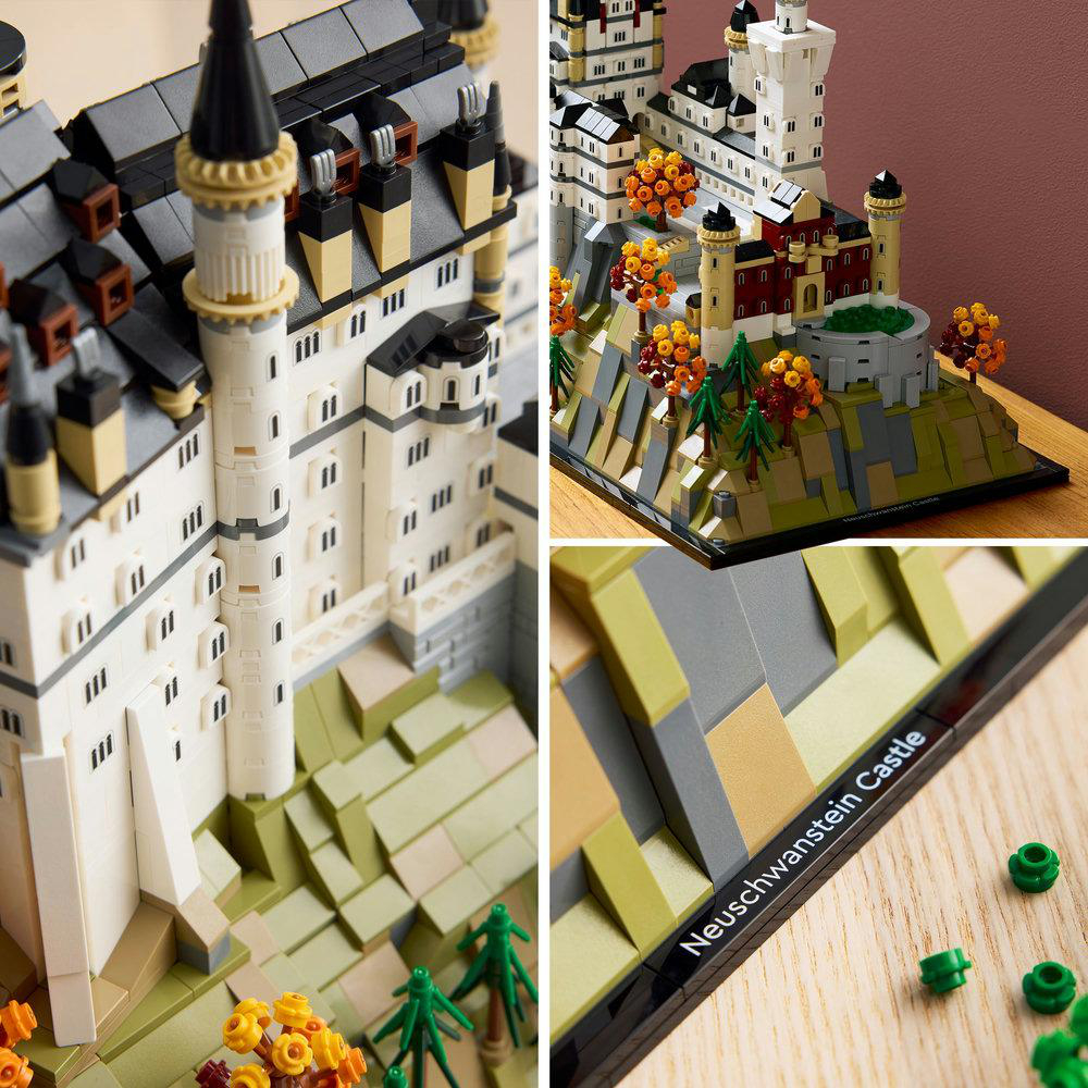 Ein Lego-Modell von Schloss Neuschwanstein. Es hat weiße Mauern, graue Dächer und schwarze Türme. Die Basis enthält grüne und gelbe Blätter.